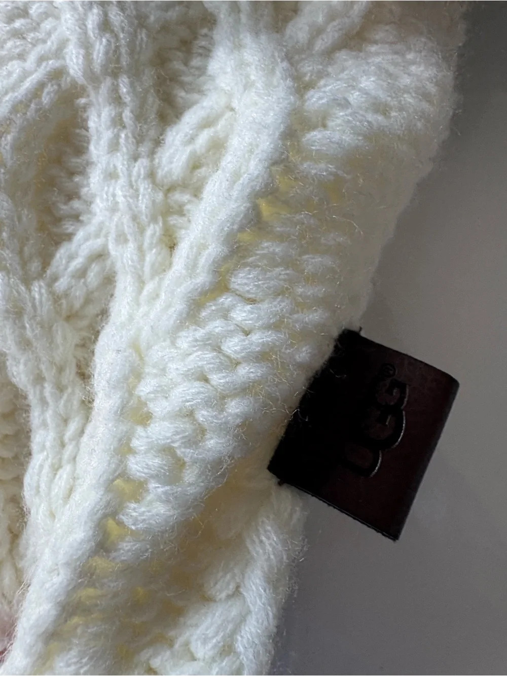 UGG Cream Cable Knit Bottle Sleeve with Faux Fur Pom Poms